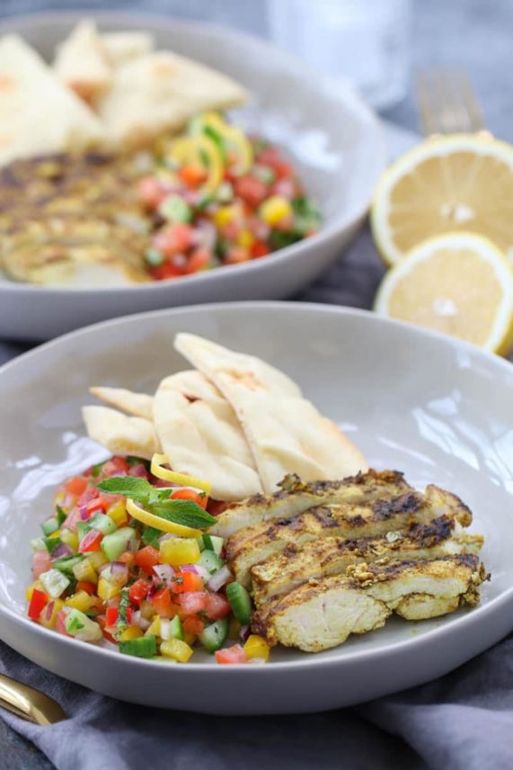 Large bowls of Chicken Shawarma with Israeli Salad