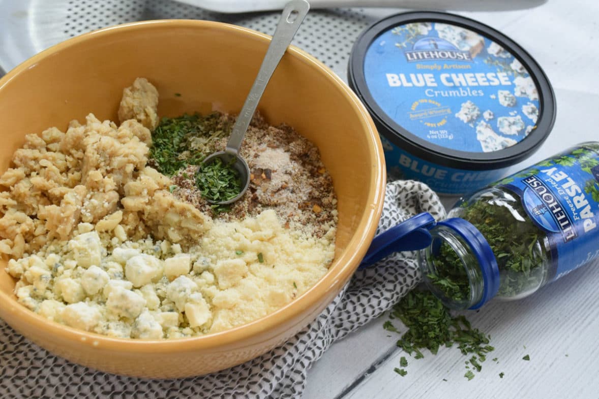 Blue Cheese Cauliflower Pizza Crust ingredients in a mixing bowl